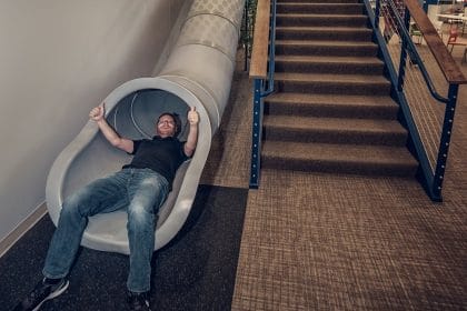 Discovery Benefits Slide with Employee going down at Fargo Office