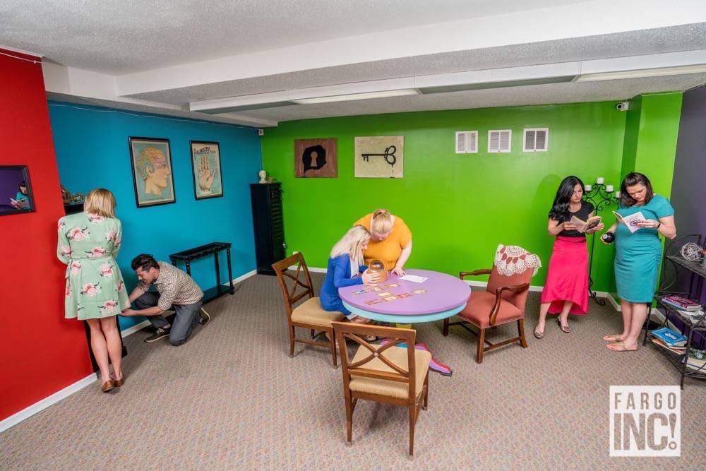 The Spotlight Media team in Madam Zella's Psychic Parlor at Puzzled Escape Rooms