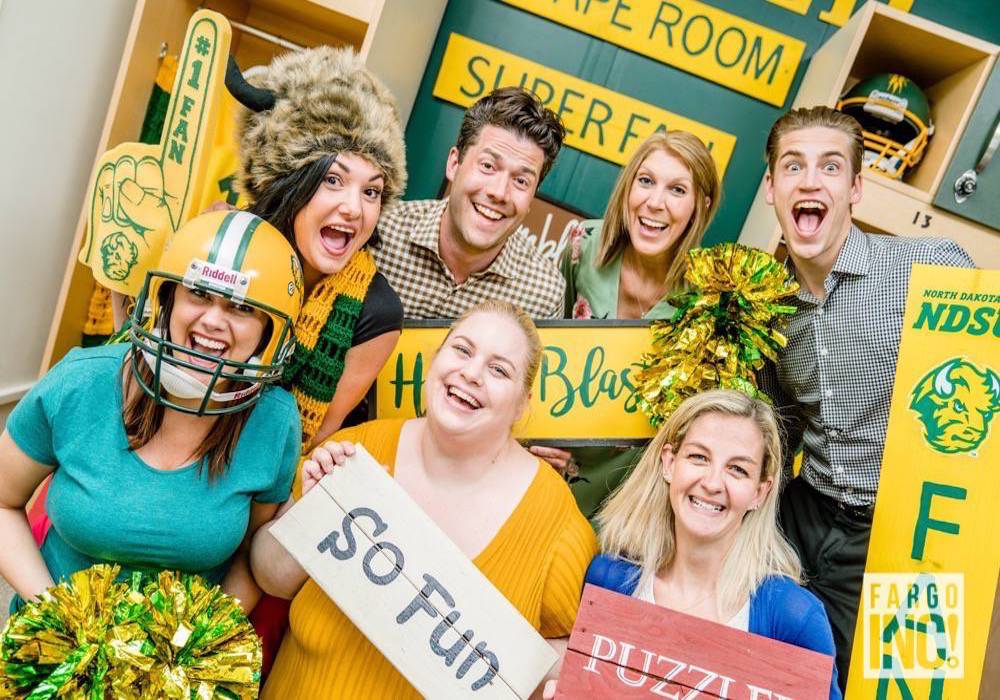 The Spotlight Media team celebrates a victory at Puzzled Escape Rooms