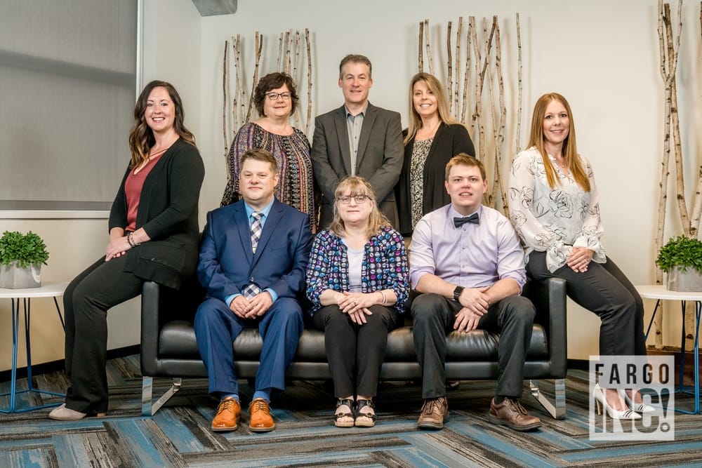 Eric Post, Connie Olgaard, Nick Halfmann, Cali Sailer, Carolyn Holtgrewe, Mitch Volk, Angie Thomas and Laura Wickham with First Community Credit Union