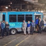 Fargo Tapride Bus With Executive Leaders In Front